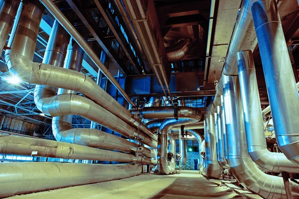 Different size and shaped pipes and valves at a power plant — Stock Photo, Image