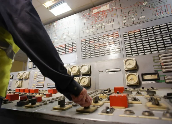 Hand on the control panel of a power plant — Stock Photo, Image