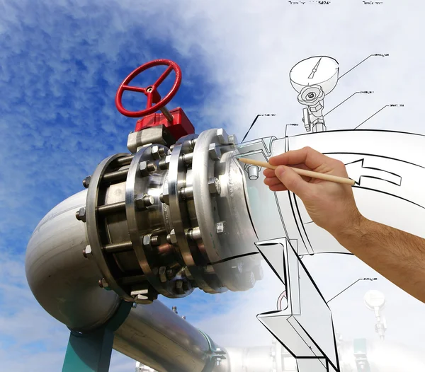 Man's hand draws a design of factory combined with photo of mode — Stock Photo, Image