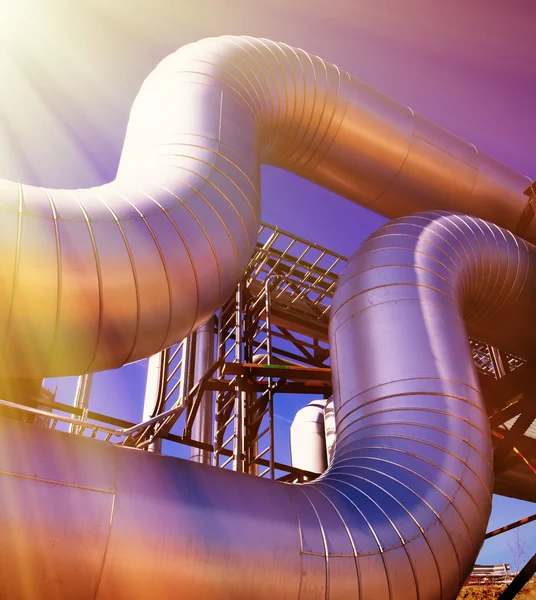 Industrial zone, Steel pipelines at sunset — Stock Photo, Image