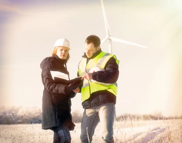 Team og engineers with wind turbines — Stock Photo, Image