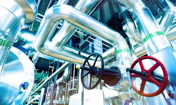 Different size and shaped pipes and valves at a power plant — Stock Photo, Image