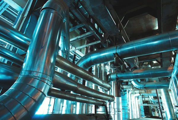 Different size and shaped pipes and valves at a power plant — Stock Photo, Image