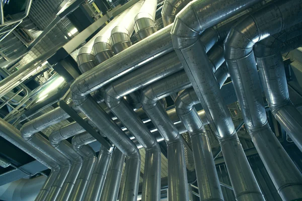 Different size and shaped pipes and valves at a power plant — Stock Photo, Image