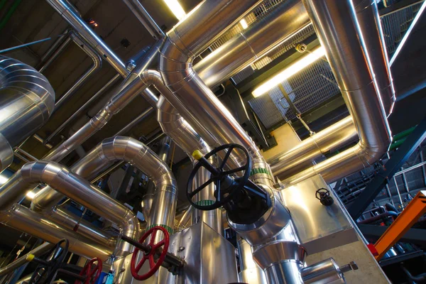 Different size and shaped pipes and valves at a power plant — Stock Photo, Image