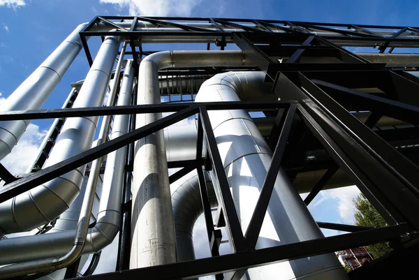 Different size and shaped pipes and valves at a power plant — Stock Photo, Image