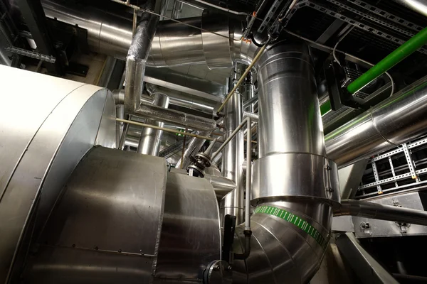 Different size and shaped pipes and valves at a power plant — Stock Photo, Image