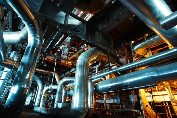 Different size and shaped pipes and valves at a power plant — Stock Photo, Image