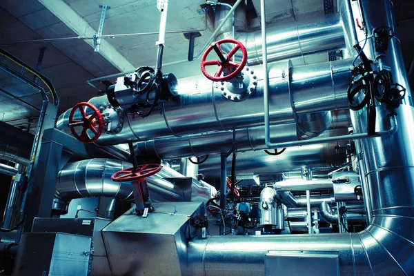 Different size and shaped pipes and valves at a power plant — Stock Photo, Image