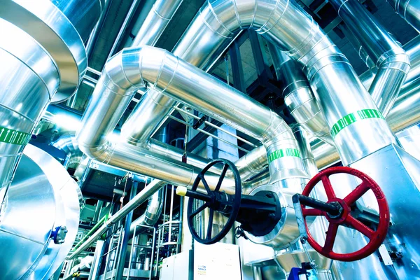 Different size and shaped pipes and valves at a power plant — Stock Photo, Image