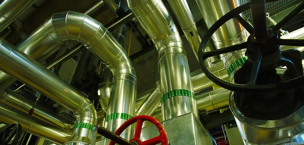 Different size and shaped pipes and valves at a power plant — Stock Photo, Image