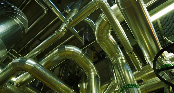 Different size and shaped pipes and valves at a power plant — Stock Photo, Image
