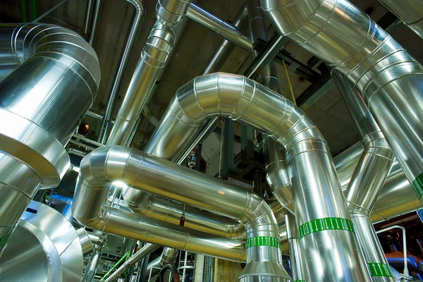 Different size and shaped pipes and valves at a power plant — Stock Photo, Image