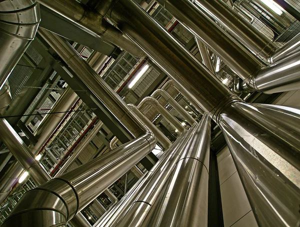 Ifferent size and shaped pipes and valves at a power plant — Stock Photo, Image