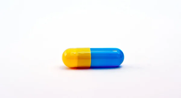 Blue-yellow capsule — Stock Photo, Image