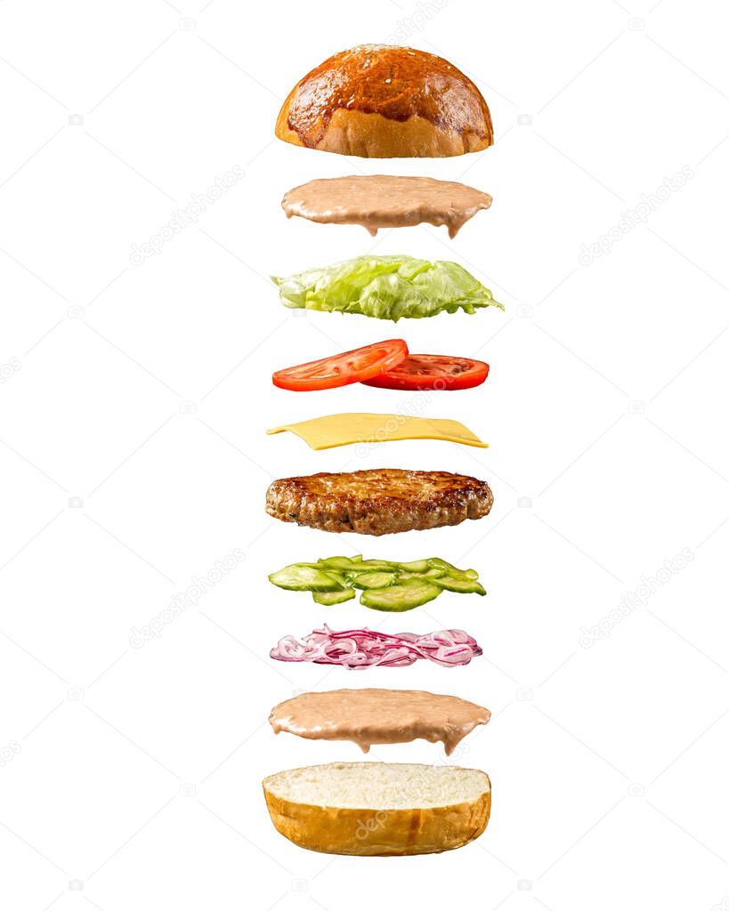 Floating burger ingredients on white background