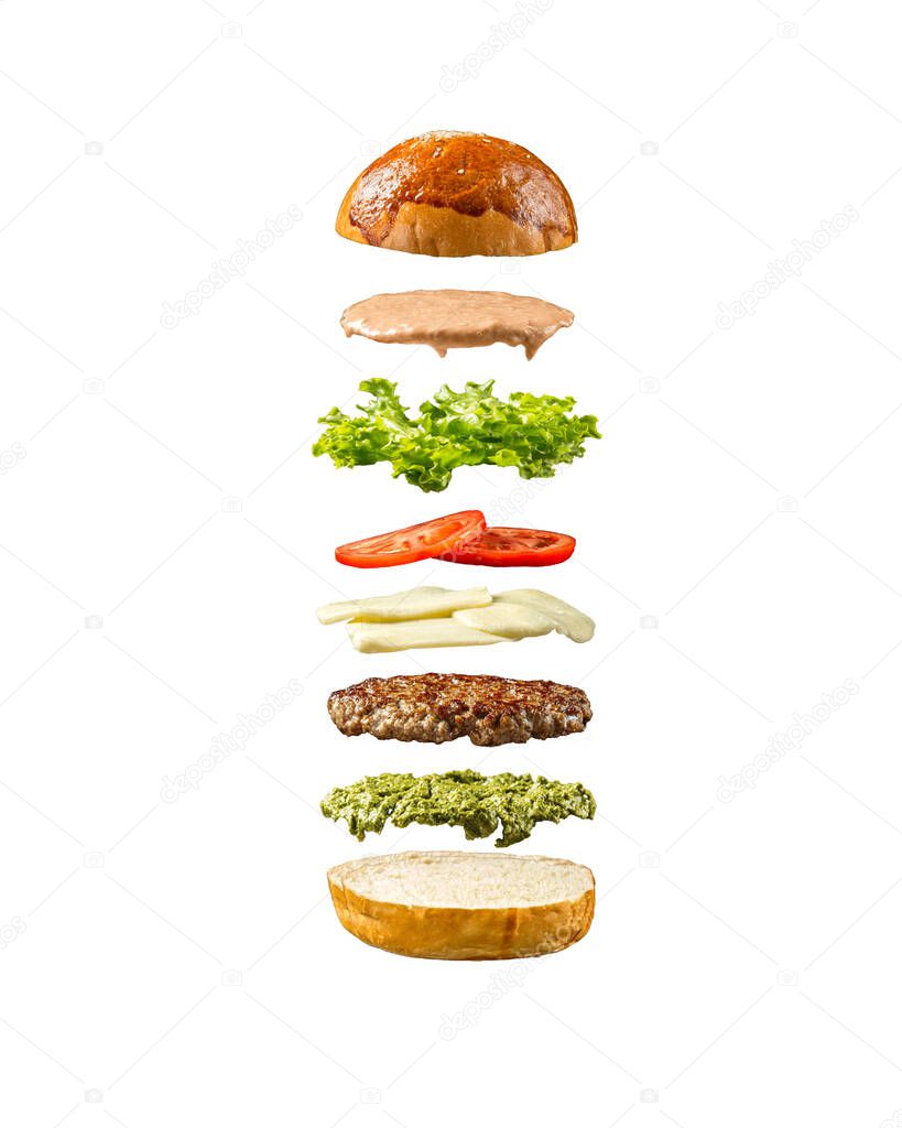 Floating burger ingredients on white background
