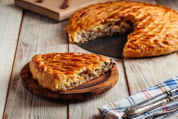 Cut pie with beef and pumpkin filling — Stock Photo, Image