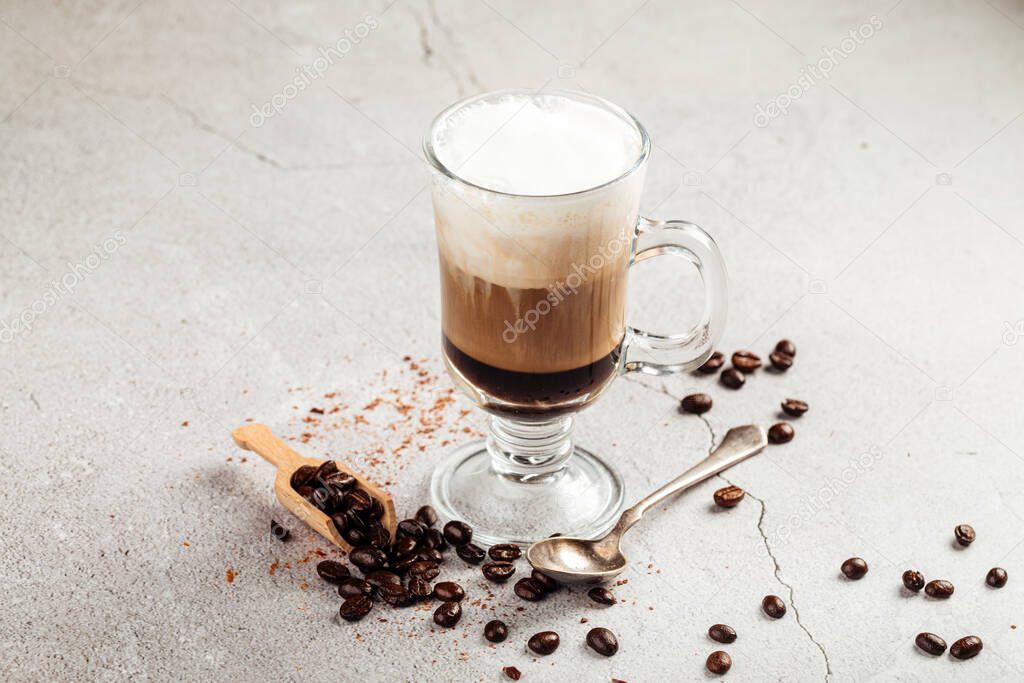 Coffee moccacino with chocolate in a glass mug