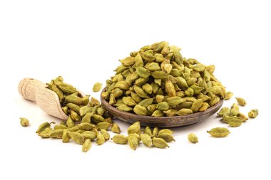 Tahta tabakta kakule tohumları ve kepçe