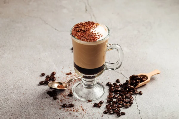 Mocaccino coffee in a glass mug with beans — Stock Photo, Image