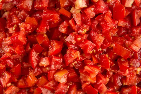 Primer plano sobre fondo de textura de tomate picado rojo — Foto de Stock