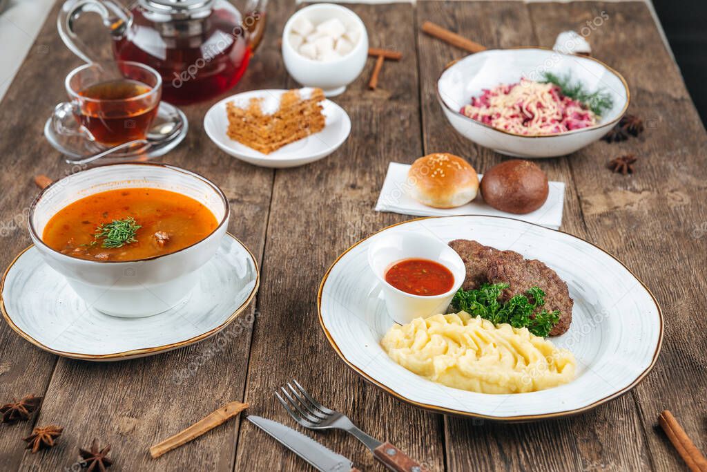 Wooden table served with russian dishes for lunch