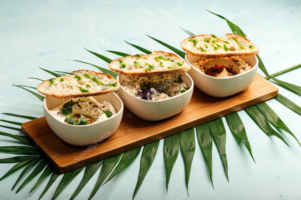 Mazeh appetizers set with hummus and other dips