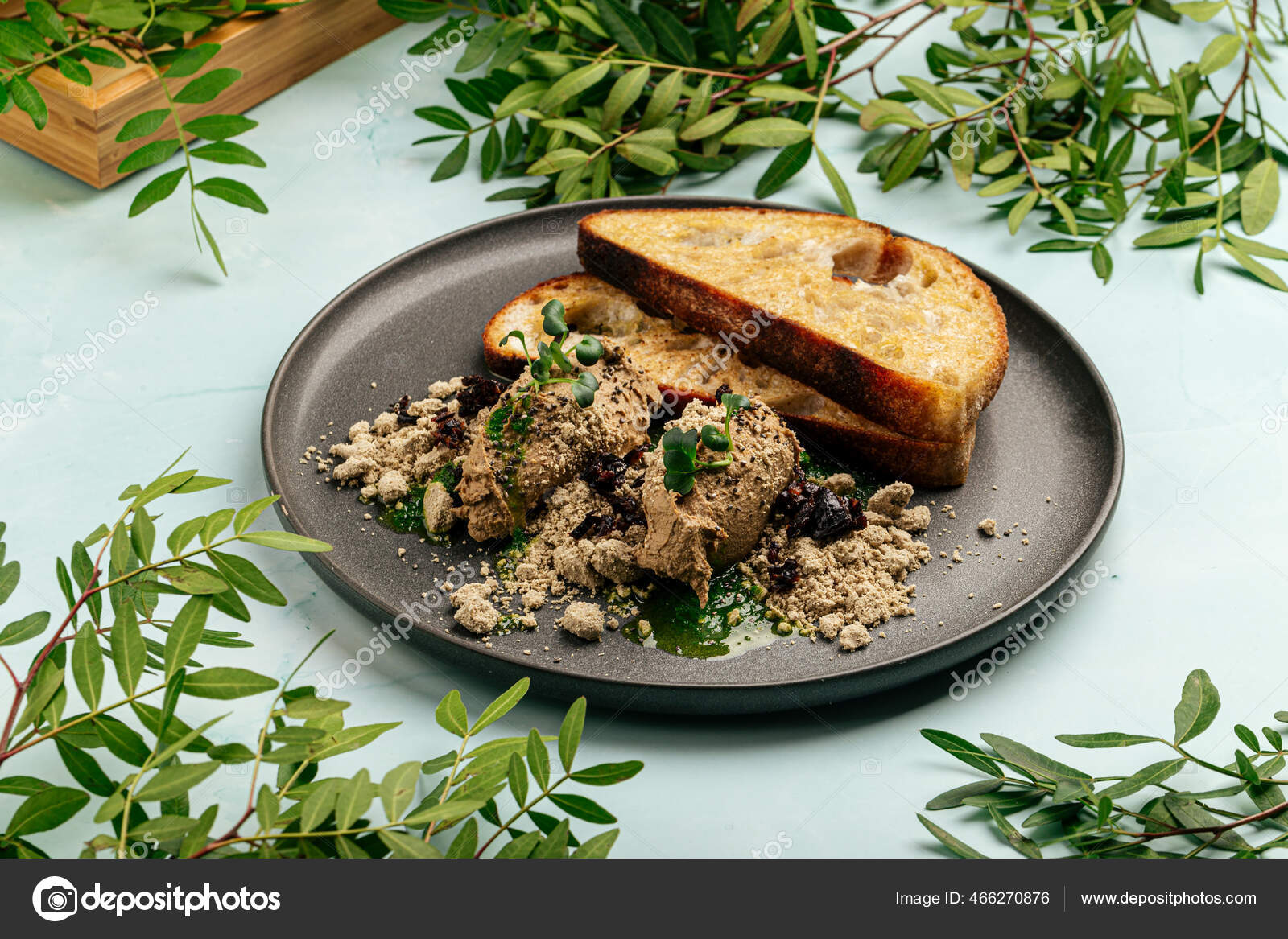 Toasts chicken liver pate with halva and prunes Stock Photo by