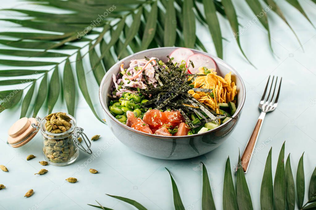 Hawaiian salmon poke bowl with rice and vegetables