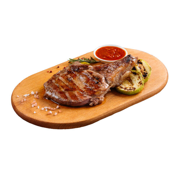 Isolated portion of grilled steak with squash