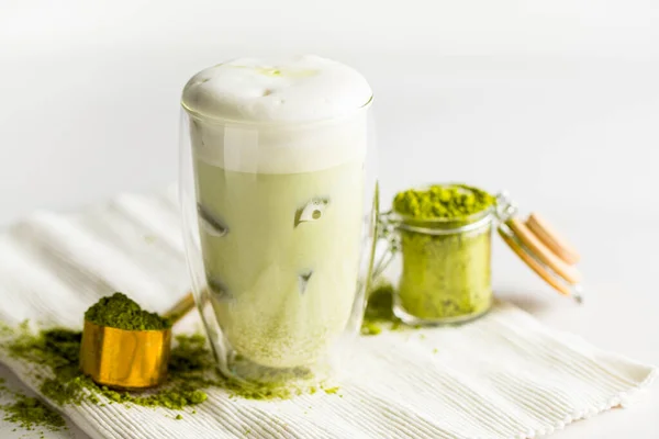 Glass of matcha green tea with ice cubes — Stock Photo, Image