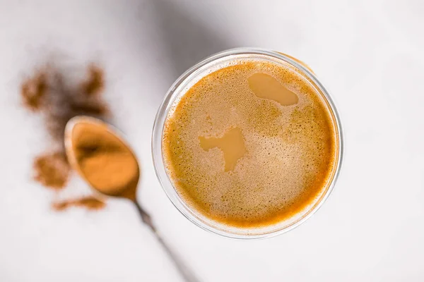 Top view on glass of coffee latte with cinnamon — Stock Photo, Image