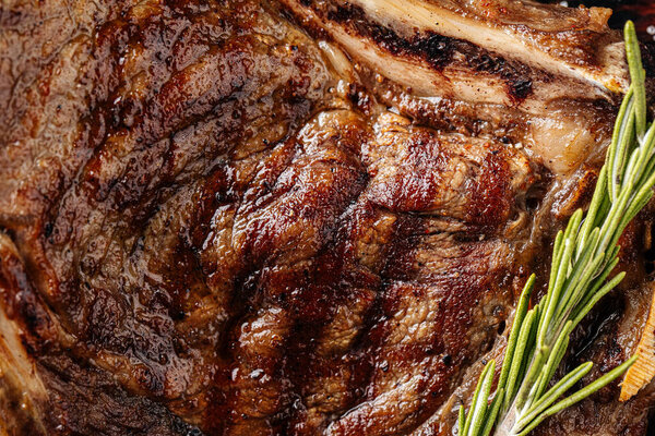 Horizontal closeup on grilled beef steak texture background
