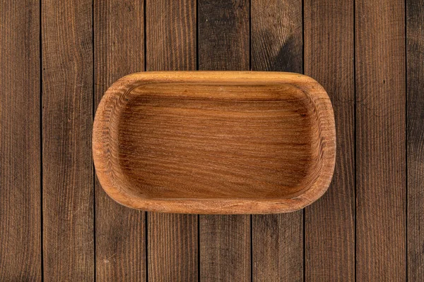 Top view on brown empty natural wooden bowl — Stock Photo, Image