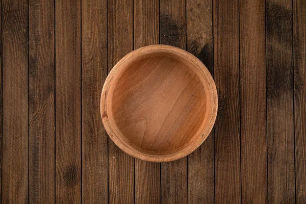 Round brown empty natural wooden bowl — Stock Photo, Image