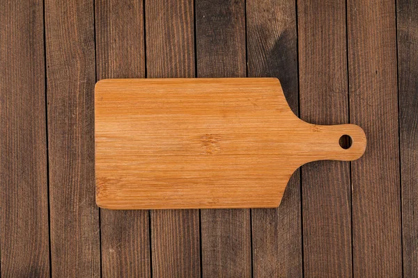 Tabla de cortar de madera marrón claro — Foto de Stock