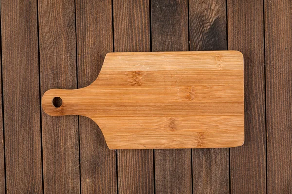 Tabla de cortar de madera marrón claro — Foto de Stock