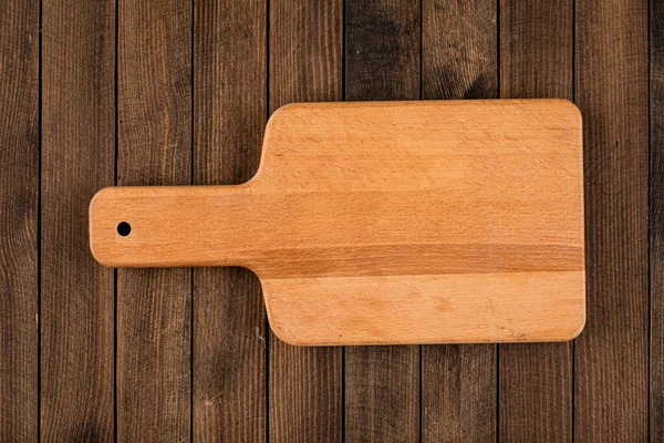 Light brown wooden cutting board — Stock Photo, Image