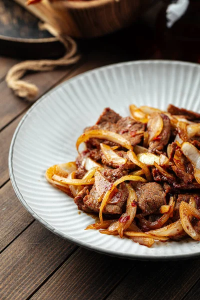 Asian spicy roast meat with onion — Stock Photo, Image