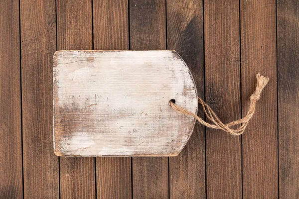 Old shabby wooden cutting board — Stock Photo, Image