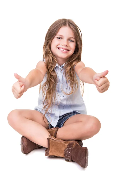 Menina sentada sobre branco — Fotografia de Stock