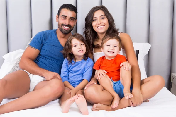 Family in bed — Stock Photo, Image