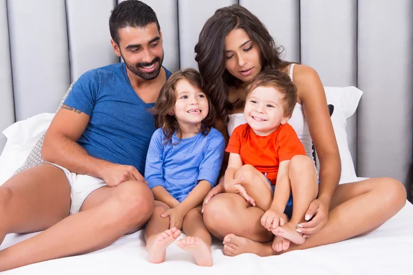Family in bed — Stock Photo, Image