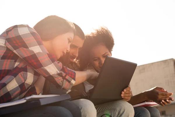 Students with laptop in Campus