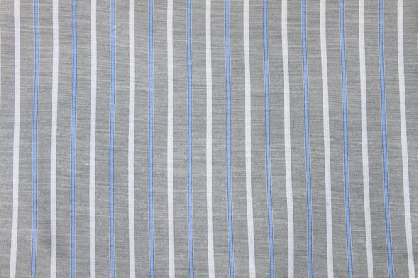 O tecido fundo têxtil com o padrão listrado — Fotografia de Stock