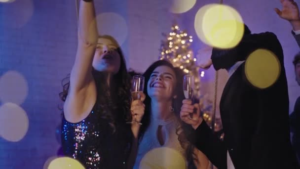 New year party for a group of beautiful young people they take selfies dancing drinking champagne and enjoying the life — Stock Video