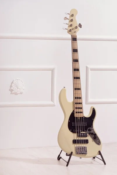 Bass guitar  near  wall — Stock Photo, Image
