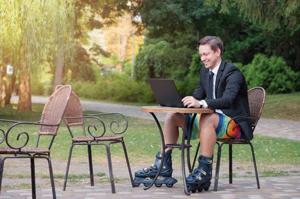 Businessman dressed in rollers