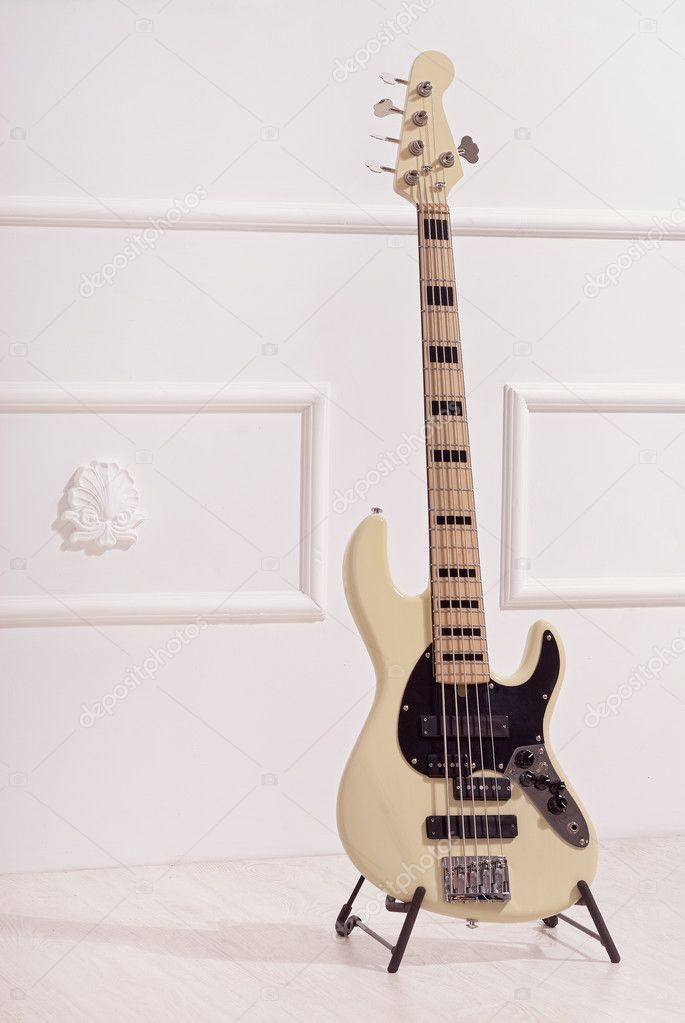 bass guitar  near  wall